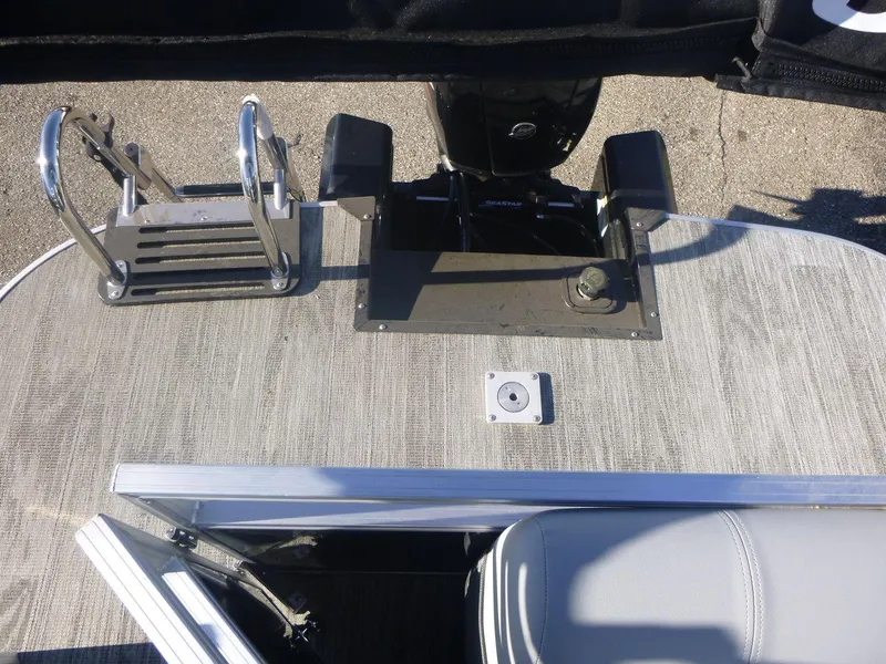 Slide: The Image of 2024 Ranger Reata 223C boat deck with motor and ladder. - 6