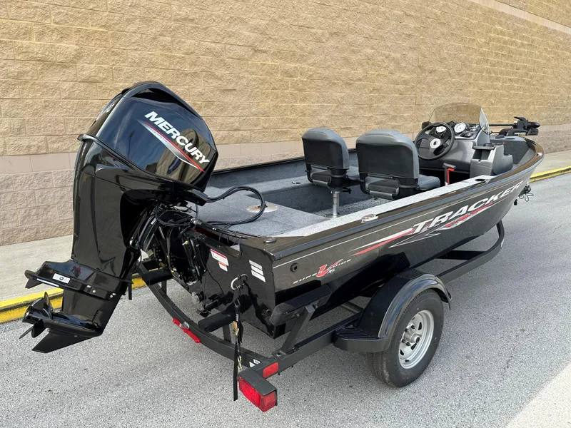 Slide: The Image of 2025 Tracker Super Guide V-16 SC fishing boat with Mercury outboard motor. - 2