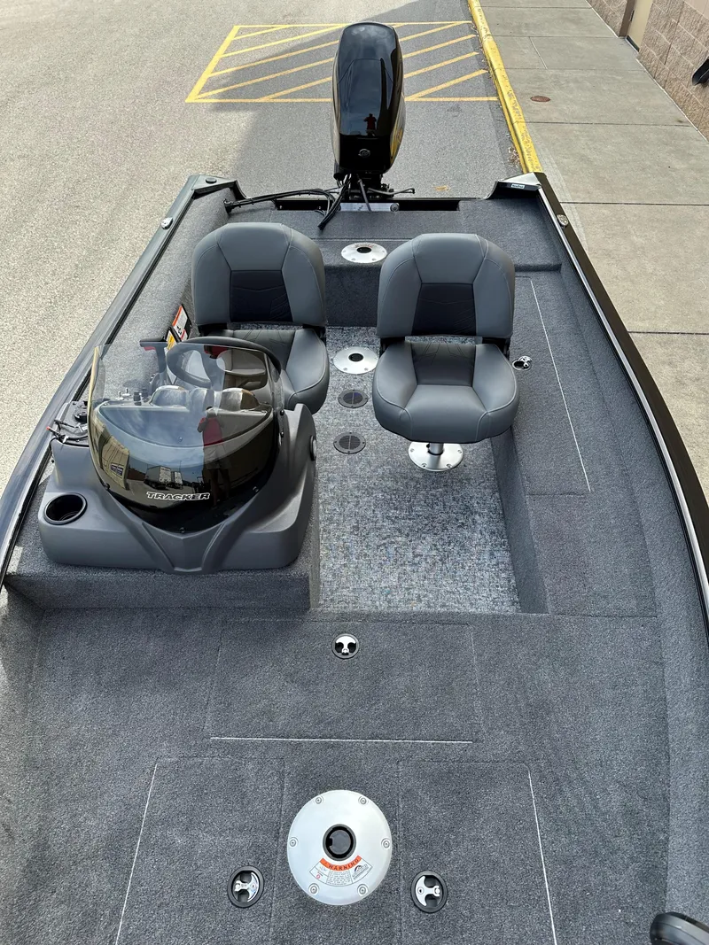 Slide: The Image of 2025 Tracker Super Guide V-16 SC fishing boat interior with dual seats and steering console. - 6