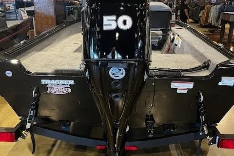 Slide: The Image of 2025 Tracker Super Guide V-16 SC boat with 50 HP engine, rear view. - 2