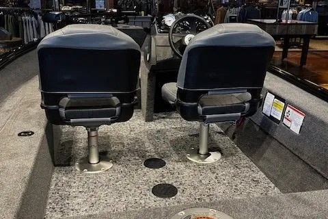 Slide: The Image of 2025 Tracker Super Guide V-16 SC boat interior with dual seats and steering console. - 3