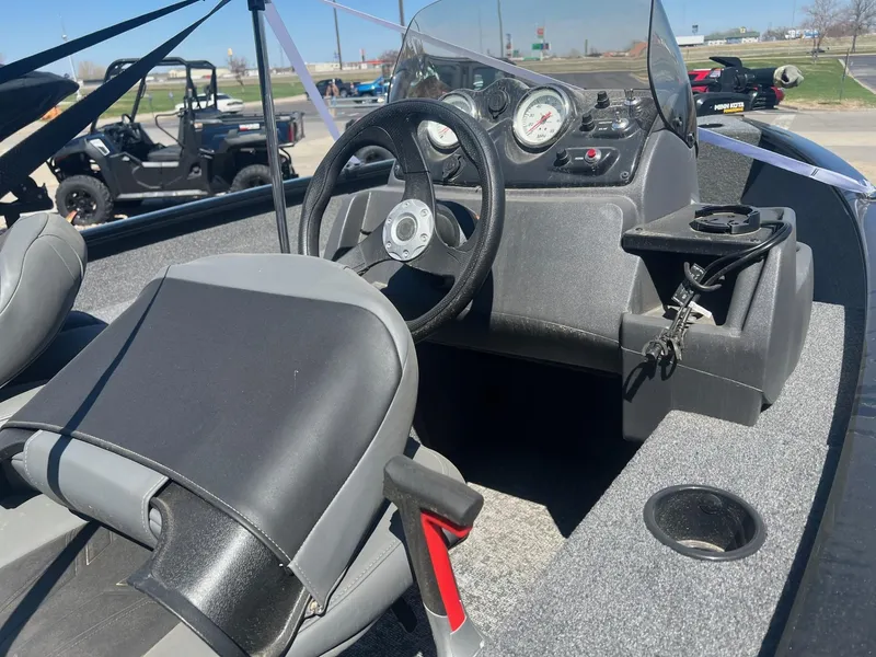 Slide: The Image of 2025 Tracker Super Guide V-16 SC boat interior with steering wheel and dashboard controls. - 3