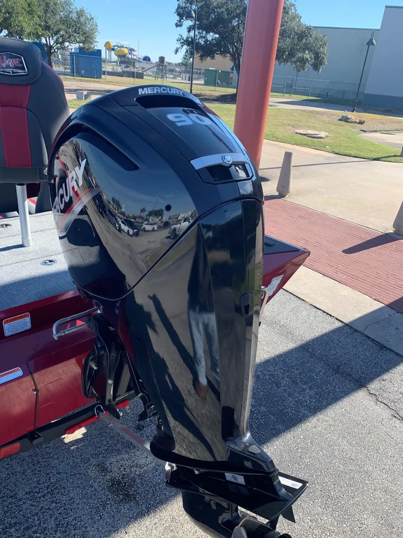 Slide: The Image of 2024 Ranger RT188 boat with Mercury outboard motor in a parking lot. - 3