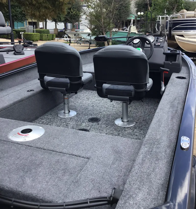 Slide: The Image of 2025 Tracker Super Guide V-16 SC fishing boat interior with dual seats. - 3