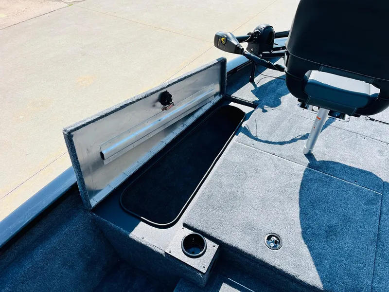 Slide: The Image of 2025 Tracker Pro Team 175 boat interior with storage compartment and seat. - 12
