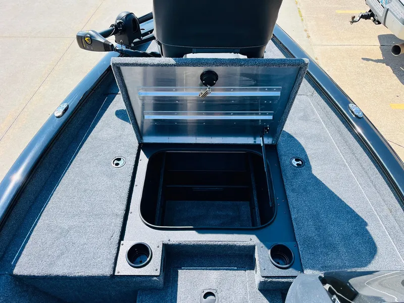 Slide: The Image of 2025 Tracker Pro Team 175 boat with open storage compartment. - 14