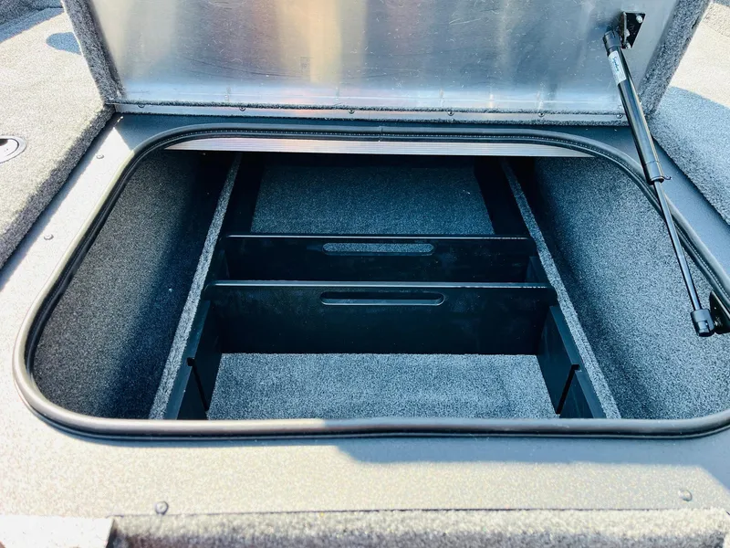 Slide: The Image of Open storage compartment of 2025 Tracker Pro Team 175 boat. - 15