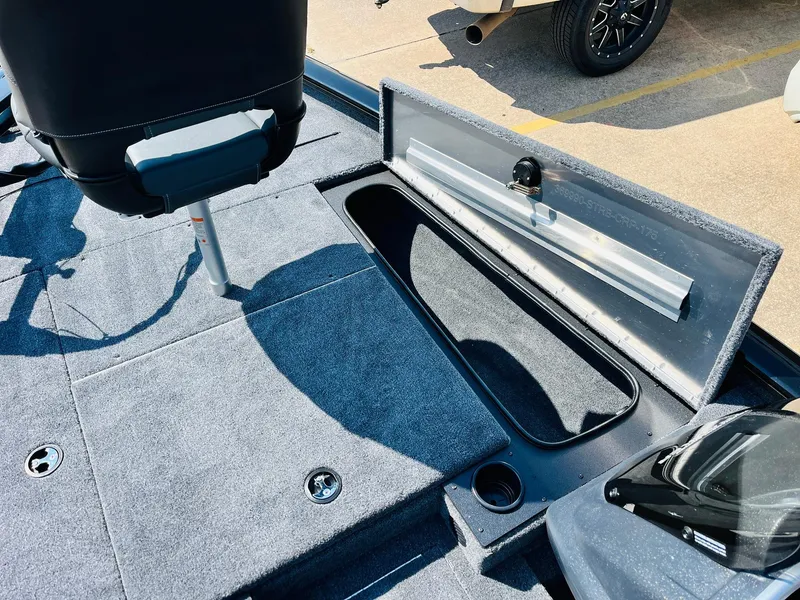Slide: The Image of 2025 Tracker Pro Team 175 boat interior with open storage compartment. - 16
