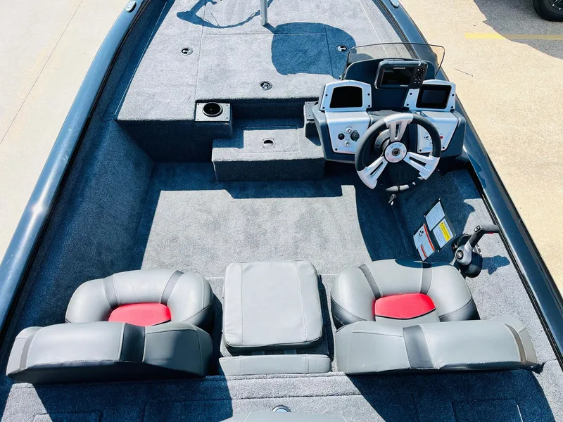 Slide: The Image of 2025 Tracker Pro Team 175 boat interior with dual seats and modern dashboard. - 21