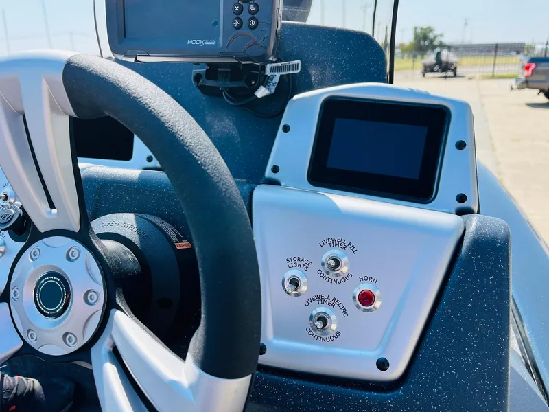 Slide: The Image of 2025 Tracker Pro Team 175 dashboard with steering wheel and control panel. - 26