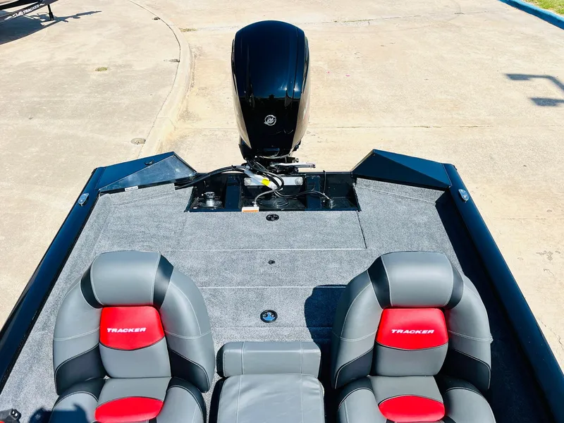 Slide: The Image of 2025 Tracker Pro Team 175 boat interior with dual seats and motor. - 31