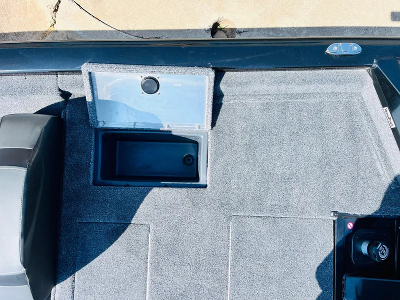 Slide: The Image of 2025 Tracker Pro Team 175 boat interior with open storage compartment. - 39