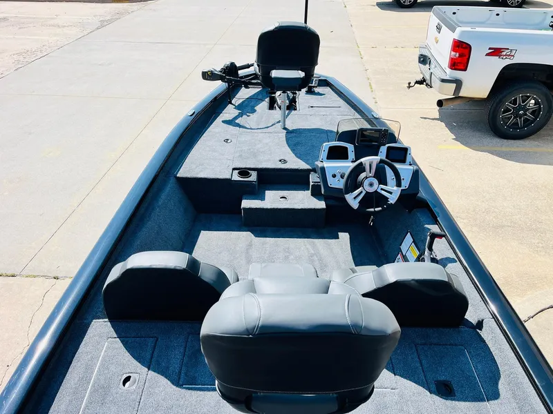 Slide: The Image of 2025 Tracker Pro Team 175 boat interior with steering console and seating. - 7
