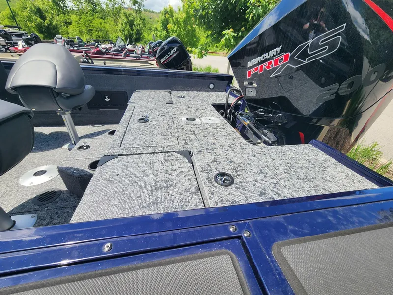 Slide: The Image of 2025 Tracker Targa V-18 Combo boat with Mercury Pro XS engine, featuring spacious deck and seating. - 3