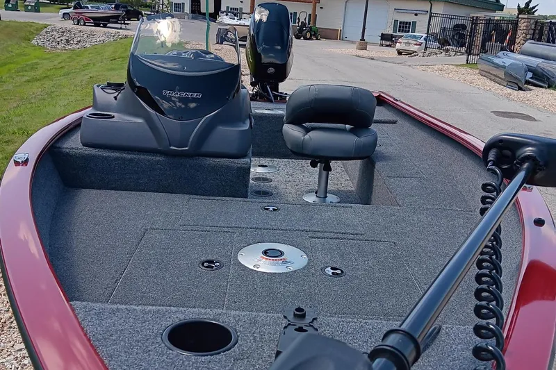 Slide: The Image of 2025 Tracker Super Guide V-16 SC fishing boat with spacious deck and seating. - 4