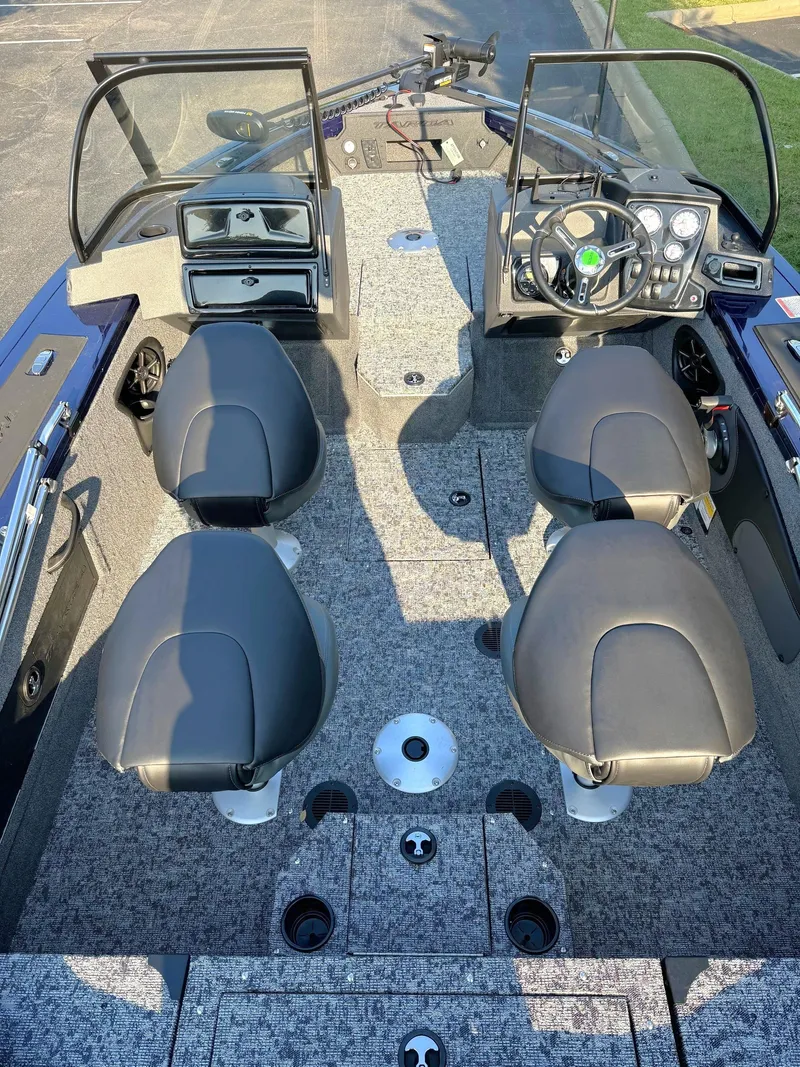 Slide: The Image of 2025 Tracker Targa V-18 Combo boat interior with four seats and modern dashboard. - 4