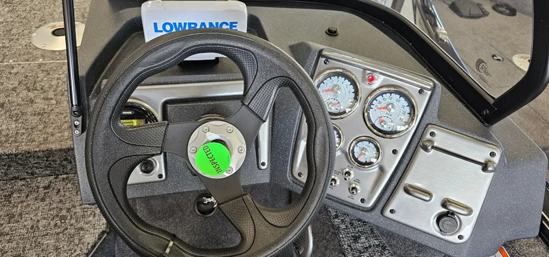 Slide: The Image of 2025 Tracker Pro Guide V-175 WT dashboard with steering wheel and gauges. - 10