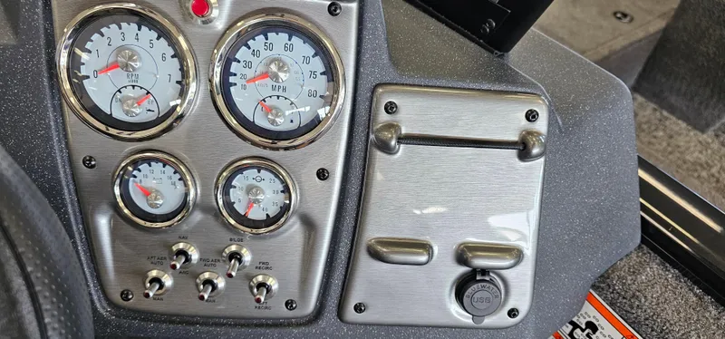 Slide: The Image of Dashboard of 2025 Tracker Pro Guide V-175 WT boat with gauges and controls. - 13