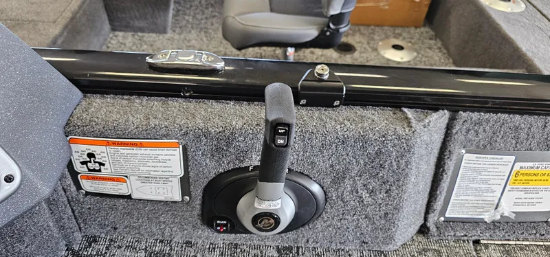 Slide: The Image of 2025 Tracker Pro Guide V-175 WT boat interior with control lever and safety warnings. - 14