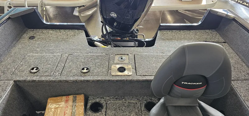 Slide: The Image of 2025 Tracker Pro Guide V-175 WT boat interior with motor and seating. - 20