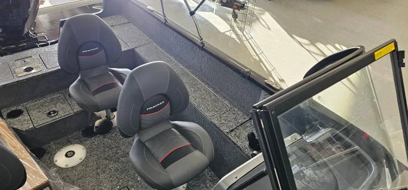 Slide: The Image of 2025 Tracker Pro Guide V-175 WT boat interior with two seats and windshield. - 5
