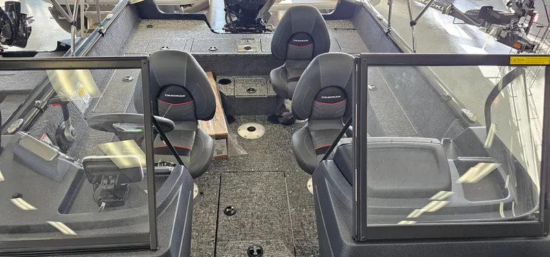 Slide: The Image of 2025 Tracker Pro Guide V-175 WT boat interior with seating and windshield. - 8