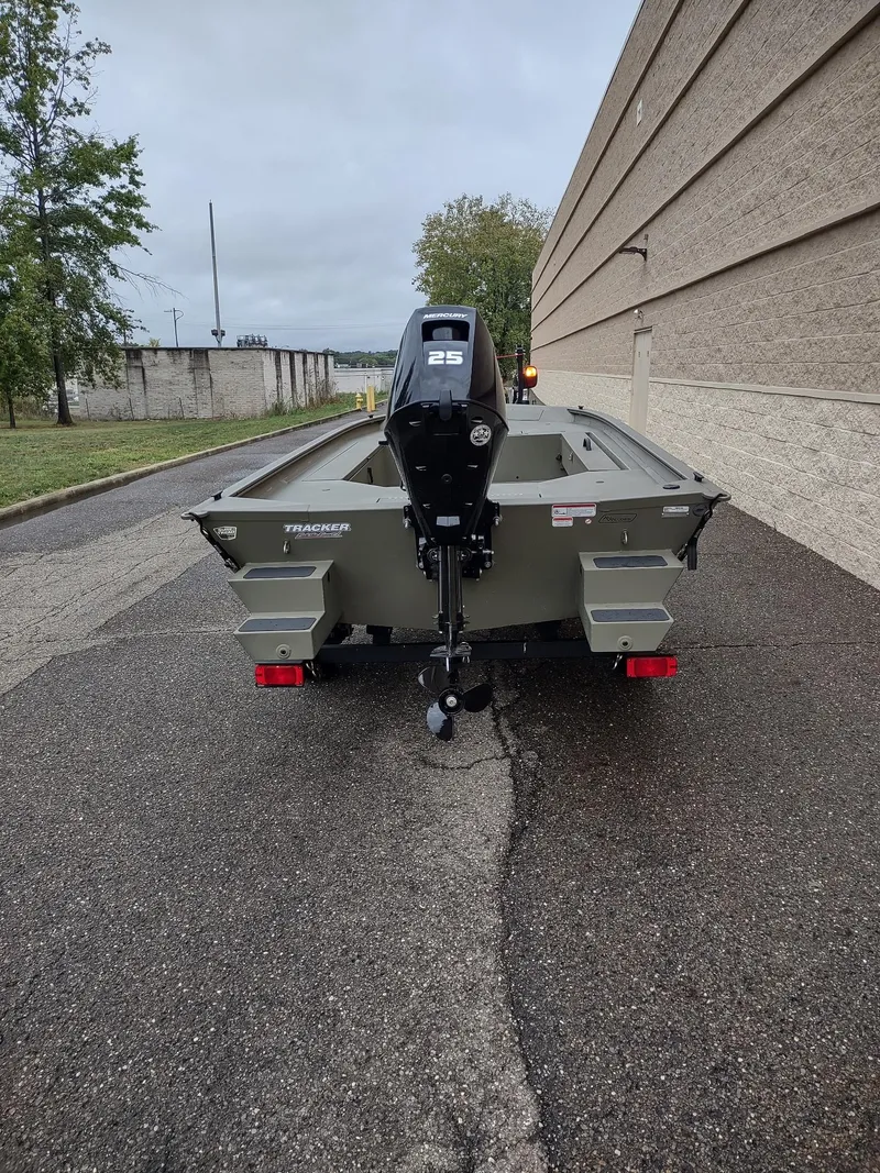 Slide: The Image of 2025 Tracker Grizzly 1654 T Sportsman boat on a trailer, rear view. - 5