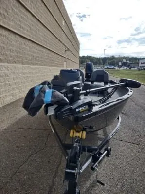 Slide: The Image of 2025 Tracker Super Guide V-16 SC boat on trailer, parked outdoors. - 3