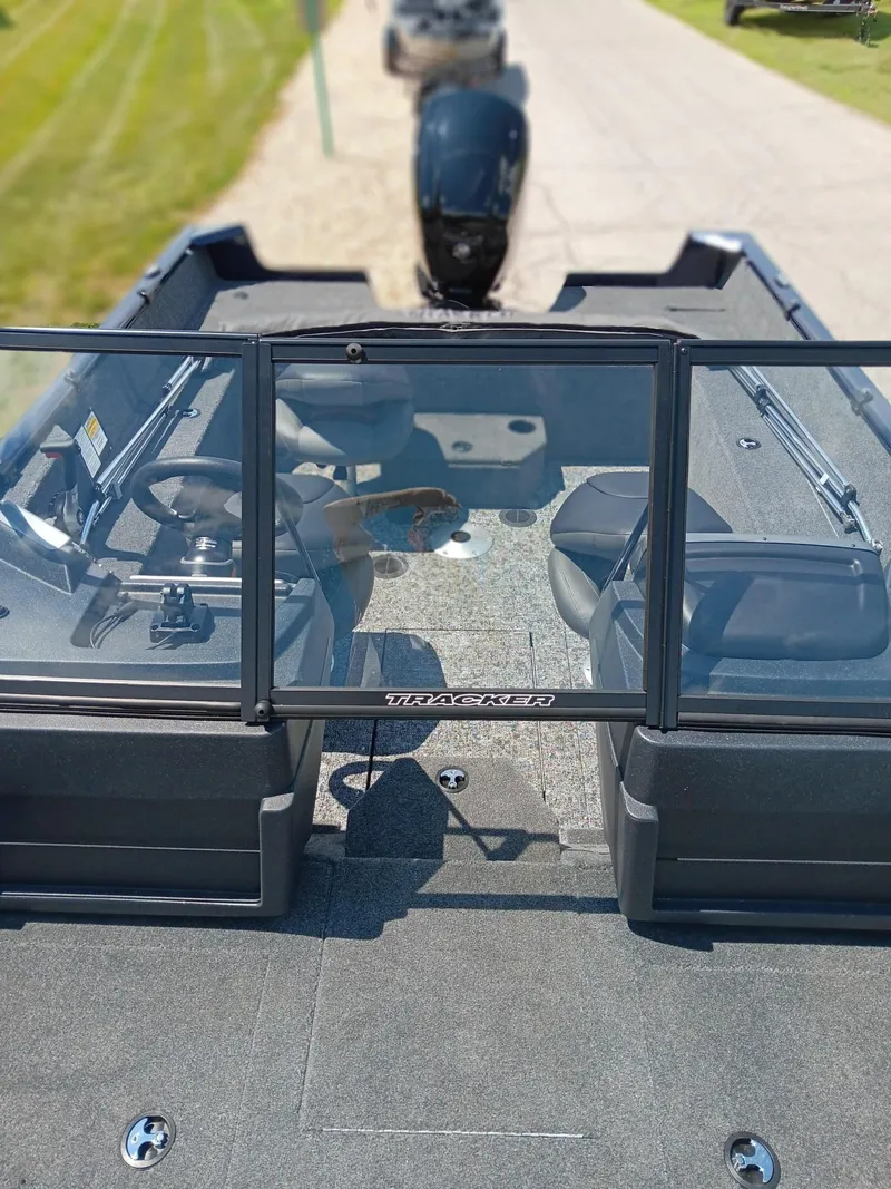 Slide: The Image of 2025 Tracker Pro Guide V-175 WT boat interior with windshield and seating. - 5