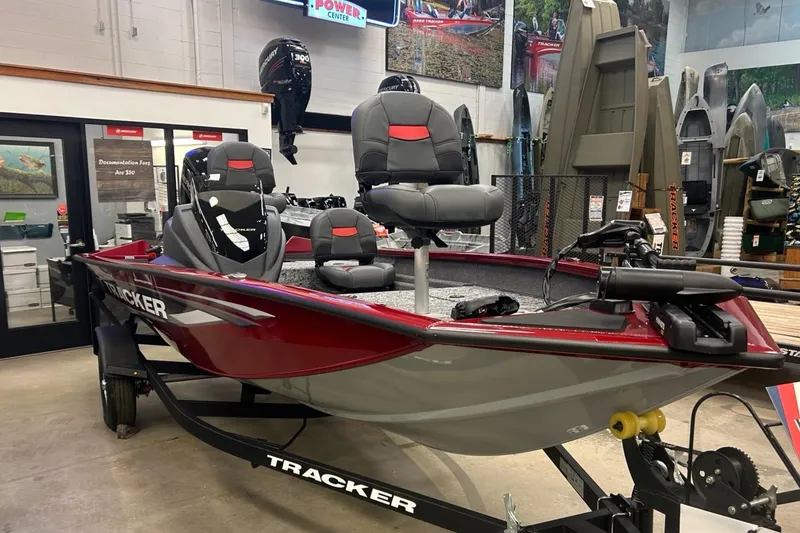 The Image of 2025 Tracker Pro Team 175 Crappie Edition boat on trailer, red with Mercury engine. - 0