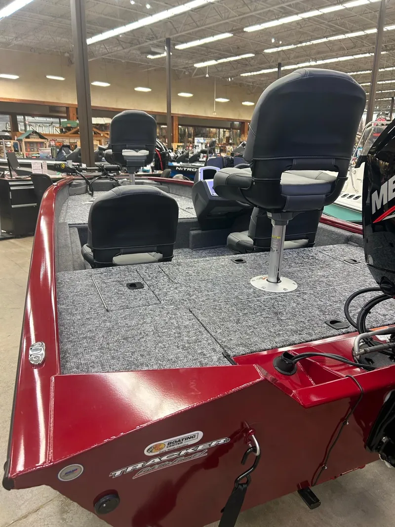 Slide: The Image of 2025 Tracker Pro Team 175 Crappie Edition boat with Mercury 75 engine, red exterior. - 2