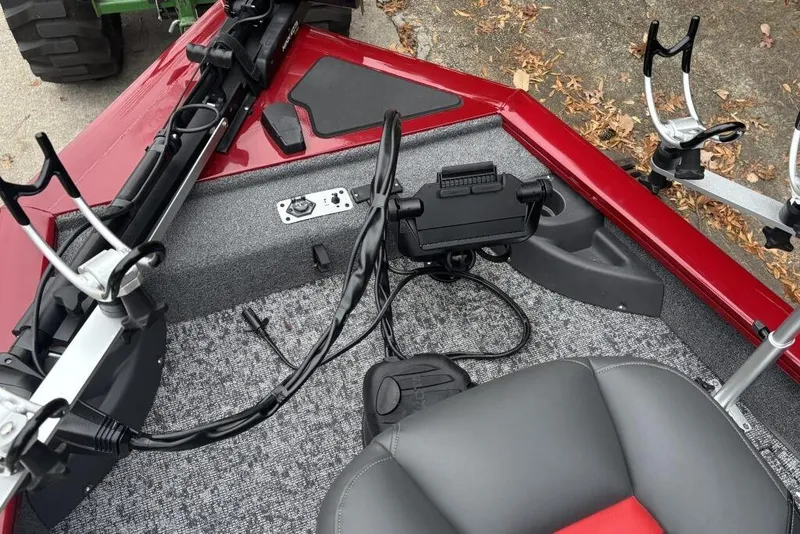Slide: The Image of 2025 Tracker Pro Team 175 Crappie Edition boat interior with gray and red seating. - 81
