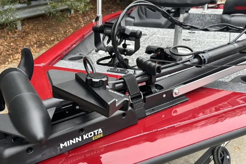 Slide: The Image of 2025 Tracker Pro Team 175 Crappie Edition boat on trailer, red and silver design. - 82