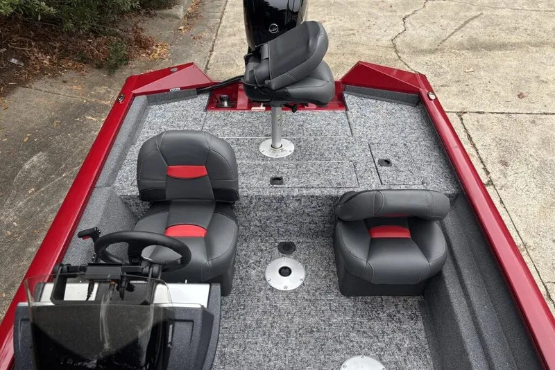 Slide: The Image of 2025 Tracker Pro Team 175 Crappie Edition boat interior with gray and red seating. - 92