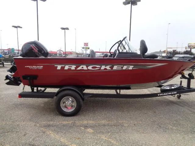 Slide: The Image of 2025 Tracker Pro Guide V-175 WT boat, red, on trailer in parking lot. - 4