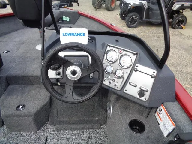 Slide: The Image of 2025 Tracker Pro Guide V-175 WT boat dashboard with steering wheel and gauges. - 8