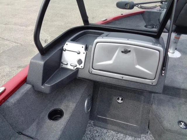 Slide: The Image of 2025 Tracker Pro Guide V-175 WT boat interior with storage compartment and cup holder. - 9