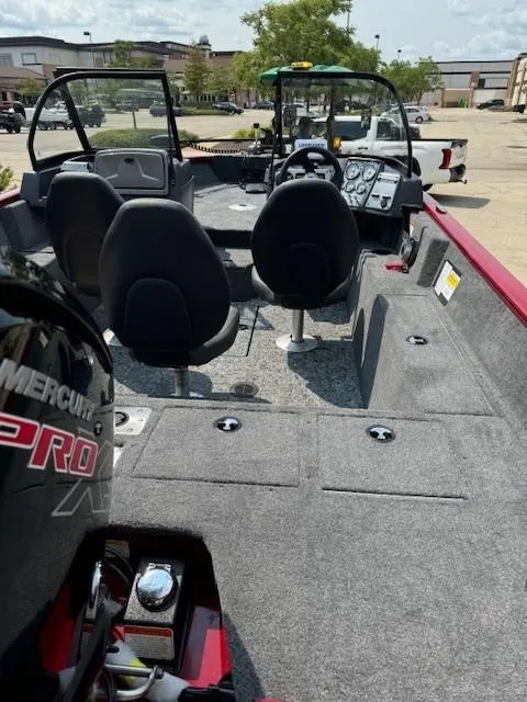 Slide: The Image of 2025 Tracker Pro Guide V-175 WT boat interior with seating and dashboard. - 2