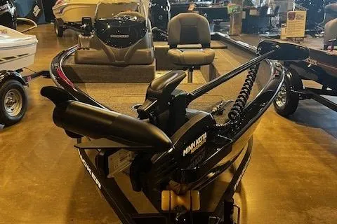 Slide: The Image of 2025 Tracker Super Guide V-16 SC boat with Minn Kota trolling motor in showroom. - 3