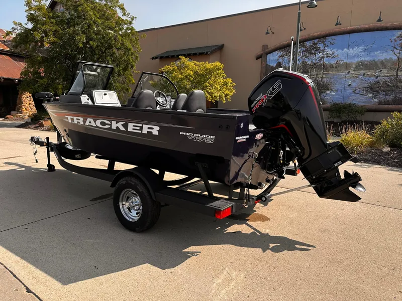 Slide: The Image of 2025 Tracker Pro Guide V-175 WT boat on trailer, outdoor setting. - 2