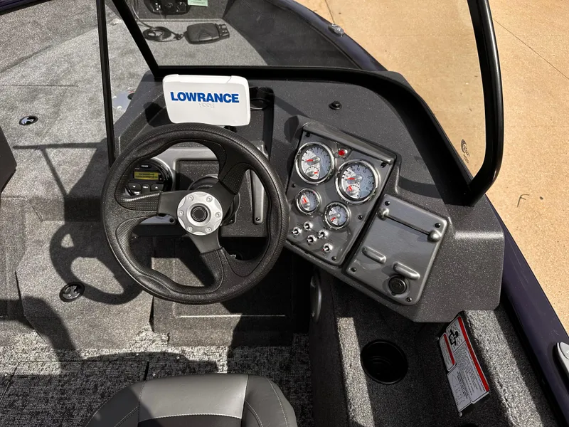 Slide: The Image of 2025 Tracker Pro Guide V-175 WT boat dashboard with Lowrance electronics and gauges. - 5
