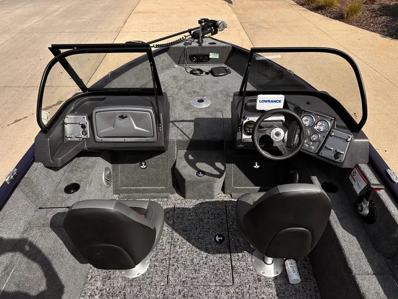 Slide: The Image of 2025 Tracker Pro Guide V-175 WT boat interior with dual seats and control panel. - 6