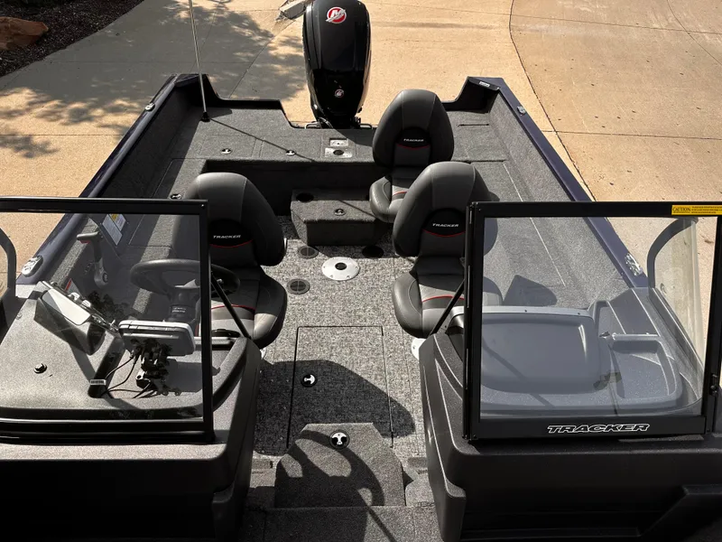 Slide: The Image of 2025 Tracker Pro Guide V-175 WT boat interior with seating and console. - 7