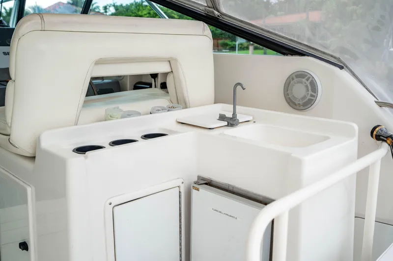 Slide: The Image of 1995 Tiara Yachts 4300 Open interior with sink and storage area. - 10