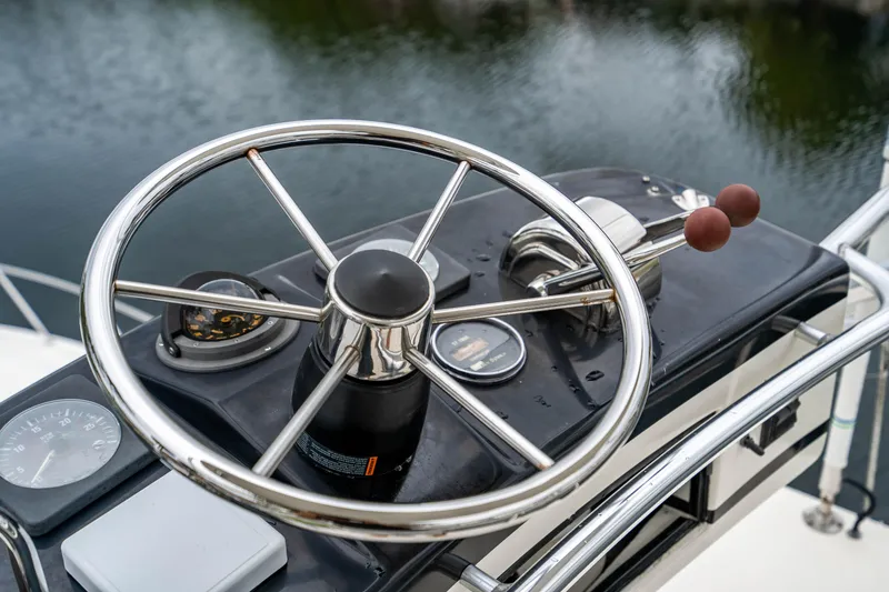 Slide: The Image of Steering wheel and controls of a 1995 Tiara Yachts 4300 Open. - 19