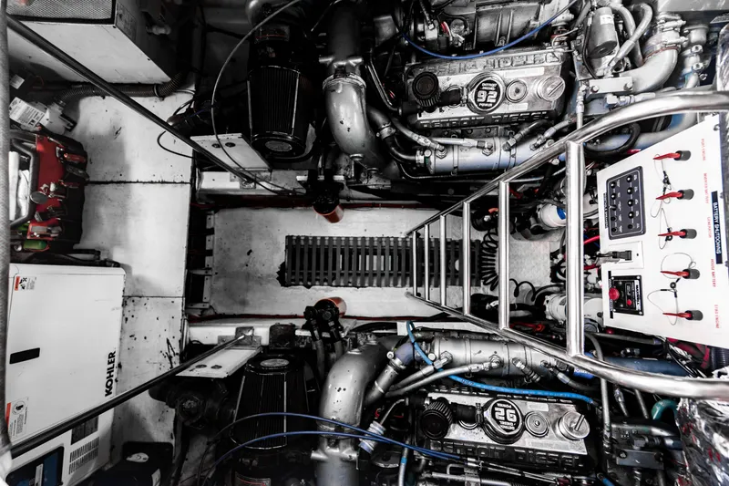 Slide: The Image of Engine room of a 1995 Tiara Yachts 4300 Open, showcasing machinery and control panels. - 35
