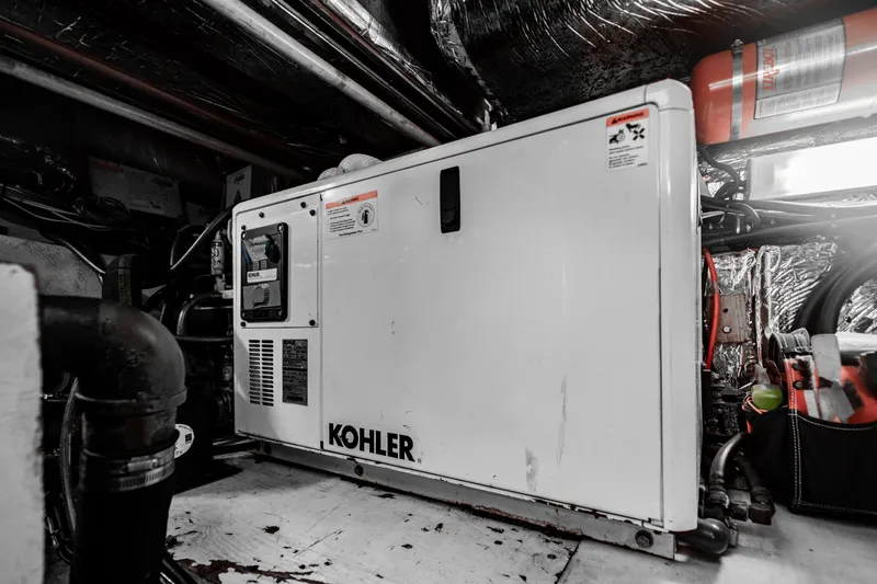 Slide: The Image of Engine room of 1995 Tiara Yachts 4300 Open with Kohler generator. - 36