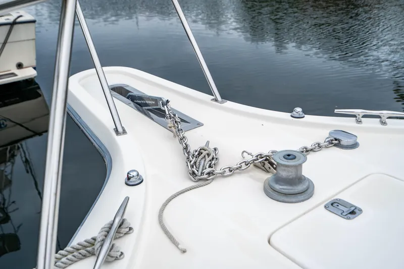 Slide: The Image of Bow of 1995 Tiara Yachts 4300 Open with anchor chain and winch. - 5