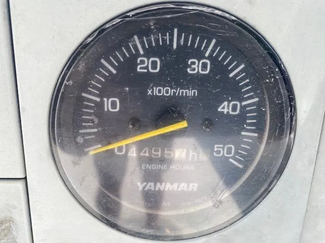 Slide: The Image of Tachometer showing 4957 engine hours on a Crowley-Beal 28, 1996 model. - 6