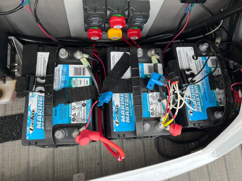 Slide: The Image of Three marine batteries in a 2021 Tahoe Grand Tahoe ELW boat. - 15